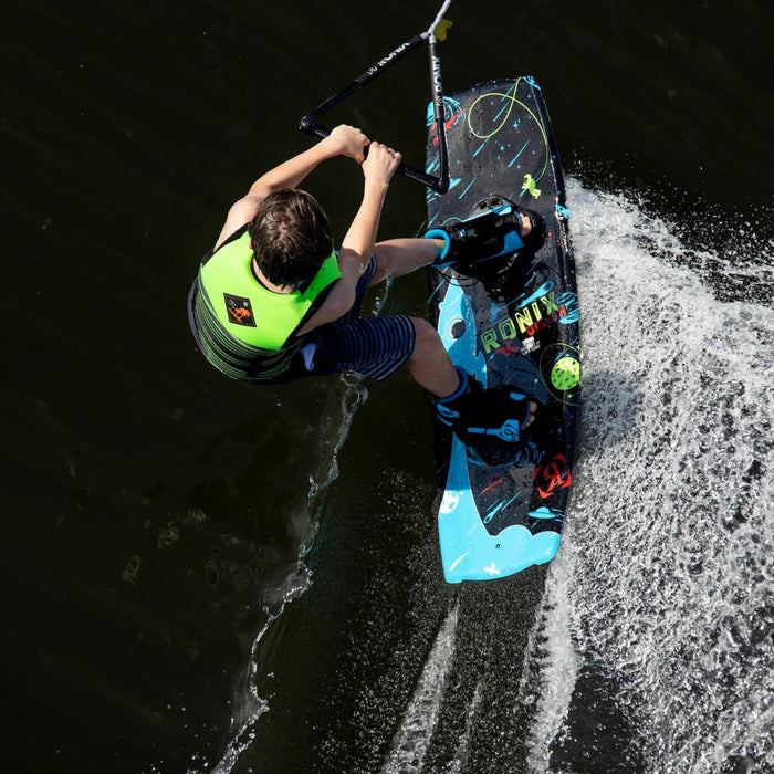 Alternative angle of a young rider cruising on the 2026 Ronix Vision youth wakeboard.