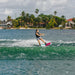 Woman rider learning to plane and ride straight behind the boat on the Ronix Krush asymmetrical wakeboard.