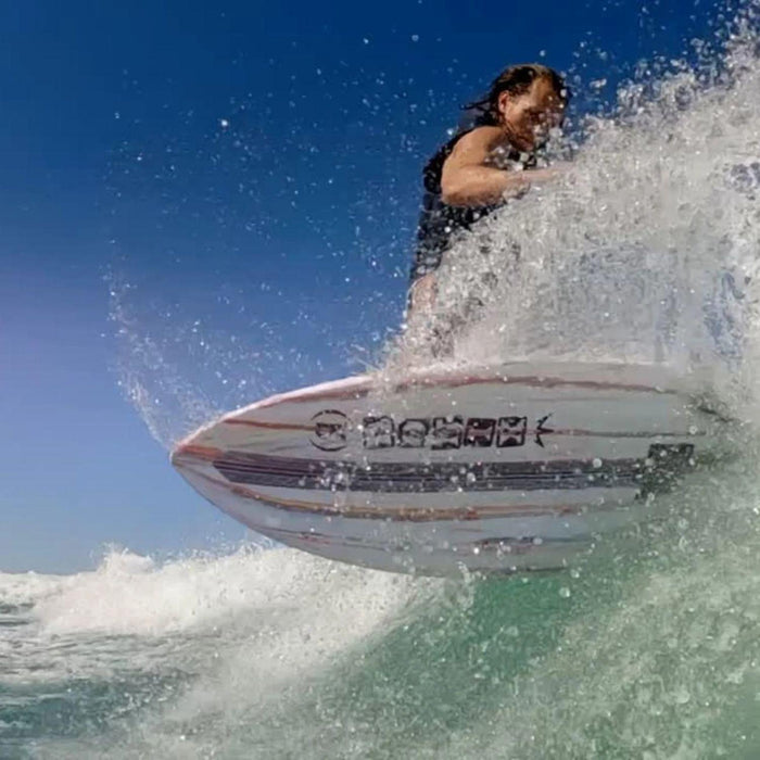 Aggressive toeside slash on the 2026 Ronix Atlantik showing the board's carving edge hold.