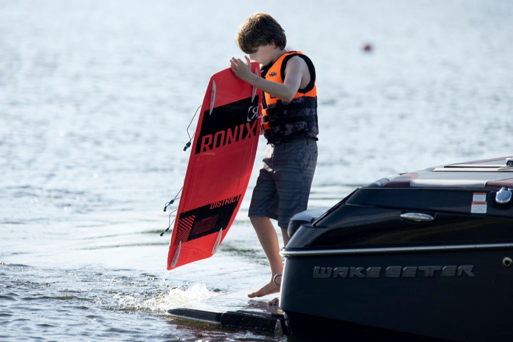 Ronix Kid's District Wakeboard Package w/ Divide Bindings 2024 - Wakesports Unlimited | Action Shot