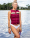 Follow Women's Signal Impact Life Vest - Maroon - Wakesports Unlimited | Action Shot