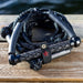 Black Phase 5 Standard Wakesurf Rope resting on a dock - Wakesports Boat Accessories.