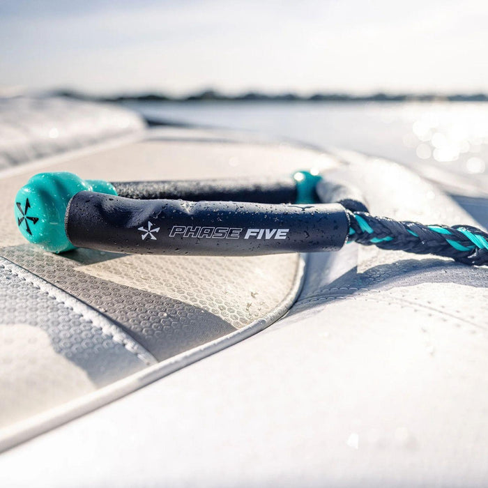 Close up of Seafoam Phase 5 Pro Surf Handle with high-tack suede grip on the back of our boat.
