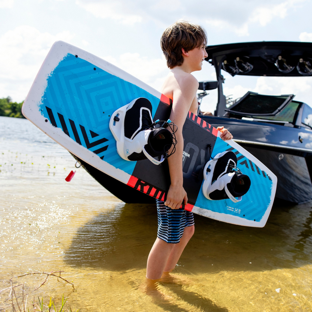 2026 Ronix District 129cm youth wakeboard product video featuring hybrid rocker technology and grom action clips.
