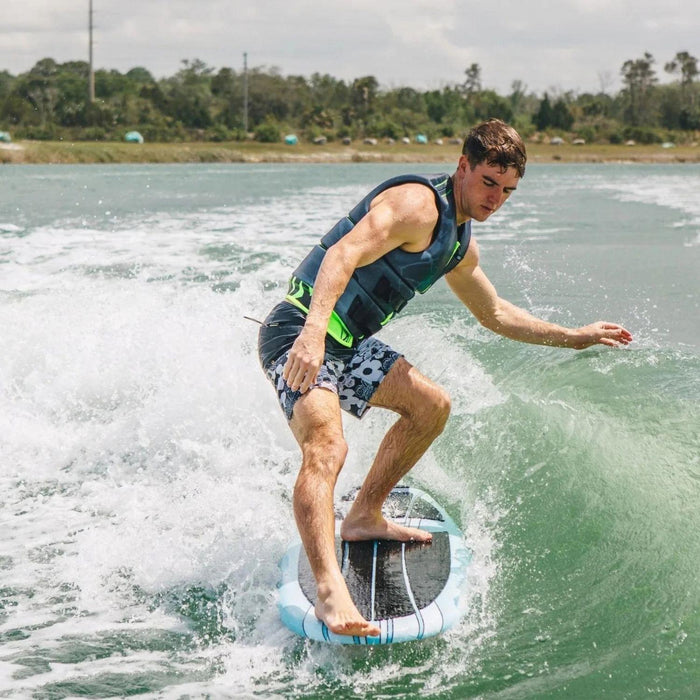 Wakesurfer performing a classic toes-to-the-nose ride on the stable 2026 Ronix Aloha Longboard.