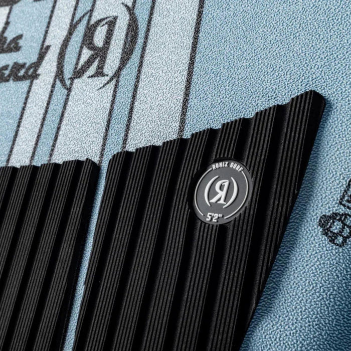 Close-up of the deck traction pad and the signature Marsh Mellow soft-top surface on the Aloha Longboard.