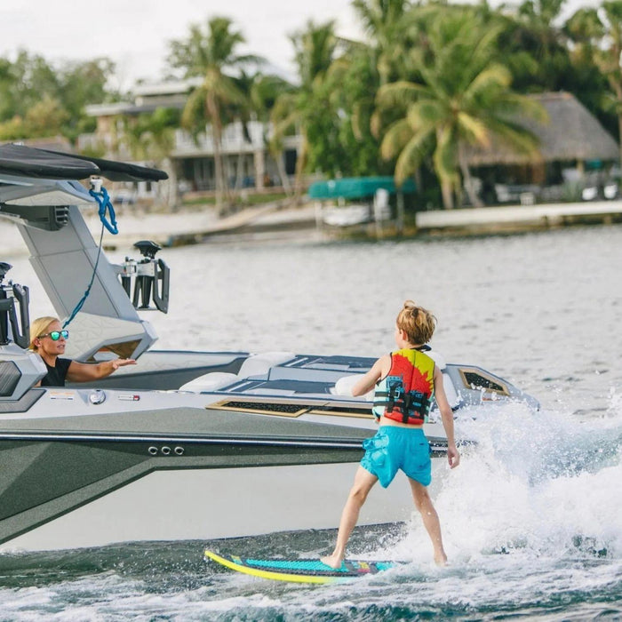 Young boy cruising on the lightweight 2026 Ronix Alpha Squad Sea Captain kid's board.