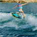 Young girl rider confidently surfing the wake on the stable Ronix Alpha Squad Sea Captain.