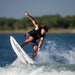 Wakesurfer performing an air 360 rotation on the 2026 Ronix Atlantik Flyweight Pro.