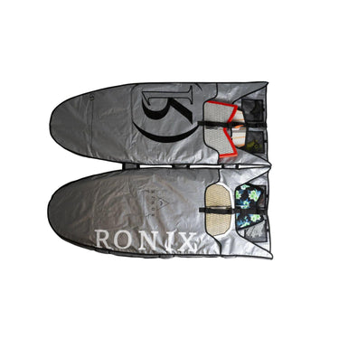 The Ronix Bimini wakesurf bag opened up flat, showcasing how its individual padded sleeves securely fit 4 wakesurf boards.