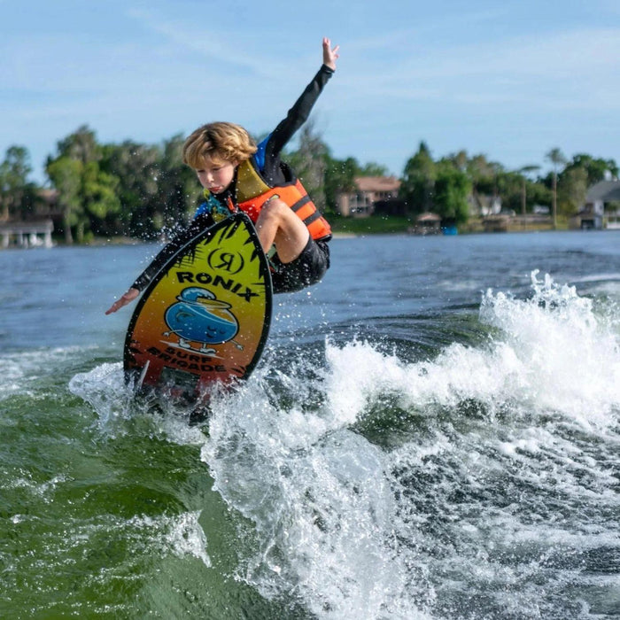 Boy, Camden Small, catching air off the wake on the lightweight 2026 Ronix Fish Sonic wakesurf board.