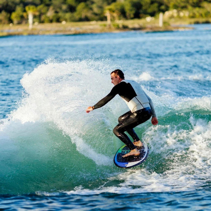 Pro rider Jake Pelot throwing a massive heelside spray on the 2026 Ronix Brightside surfer.