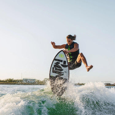 Beaux Wildman performing his signature one-leg kick-out ollie on the Carbon Air Core 4 Skimmer.