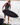 Beaux Wildman holding his new pro model, Ronix Carbon Air Core 4 Skimmer, on the swim step of his board ready for a fun session. 