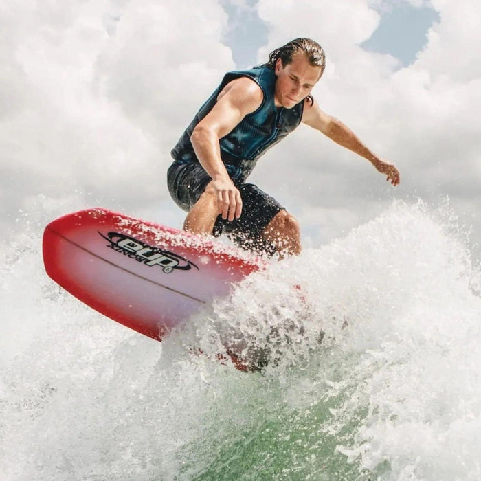 Pro wakesurfer, Bryce Gardner performing a powerful carving slash on the Ronix DNA Flyweight Pro behind a boat.