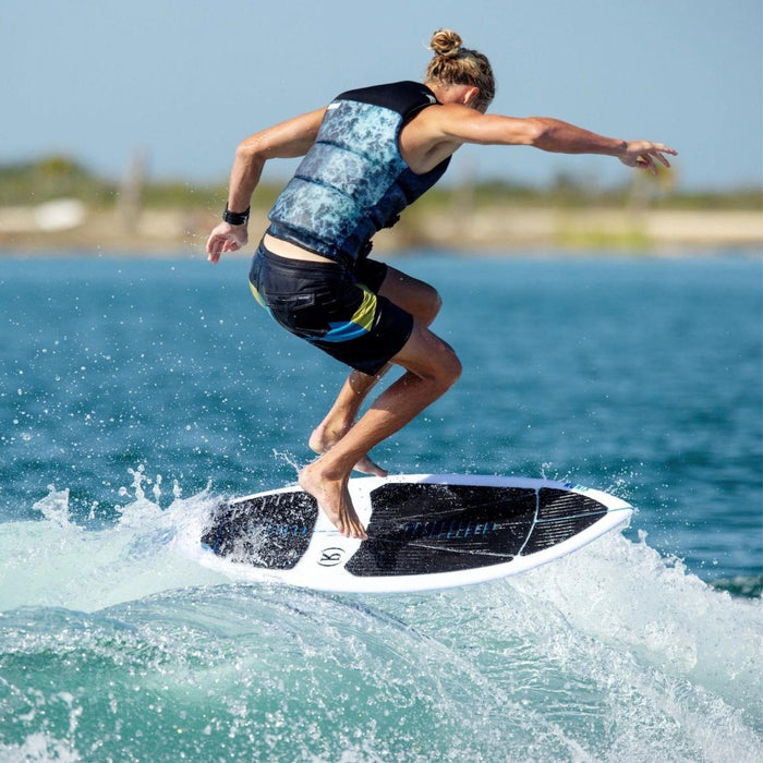Beaux Wildman executing a technical 360 surface shuv-it on the responsive Ronix Flyweight skimmer.