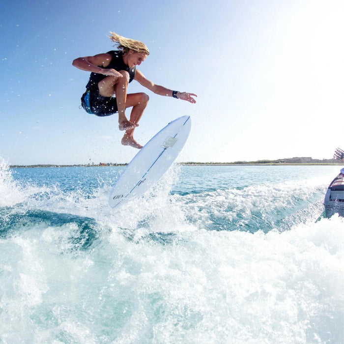 Pro rider Beaux Wildman performing a massive air shuv-it on the lightweight Ronix Flyweight skimmer.