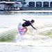 Girl rider initiating a 180-degree surface rotation on the Ronix Girl's Fish Sonic.