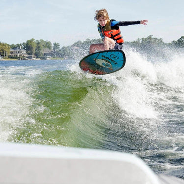 Young boy catching air and performing an ollie on the lightweight Kid's Sonic Skimmer.