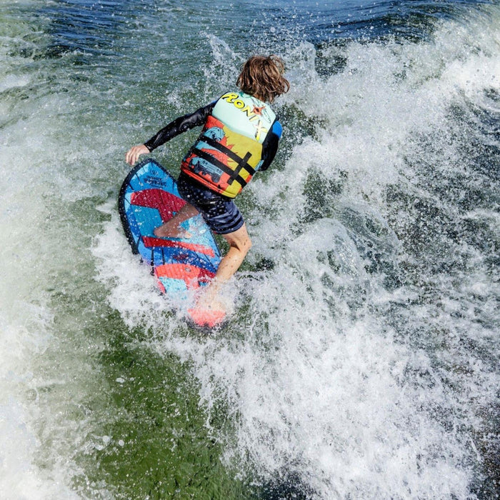 Youth rider executing a smooth surface 360 rotation on the Ronix Sonic Skimmer.