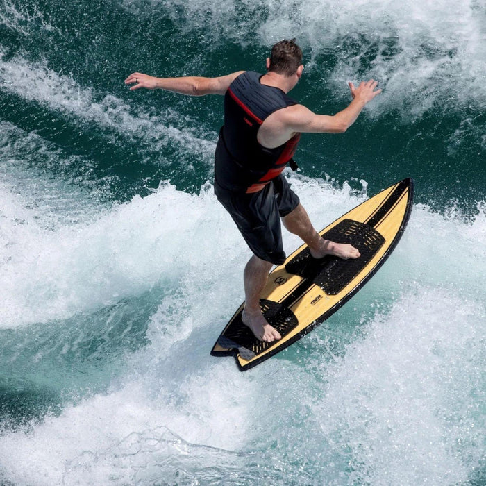 Wakesurfer performing a frontside slide on the 2026 Ronix Koal Classic Fish wakesurfer.