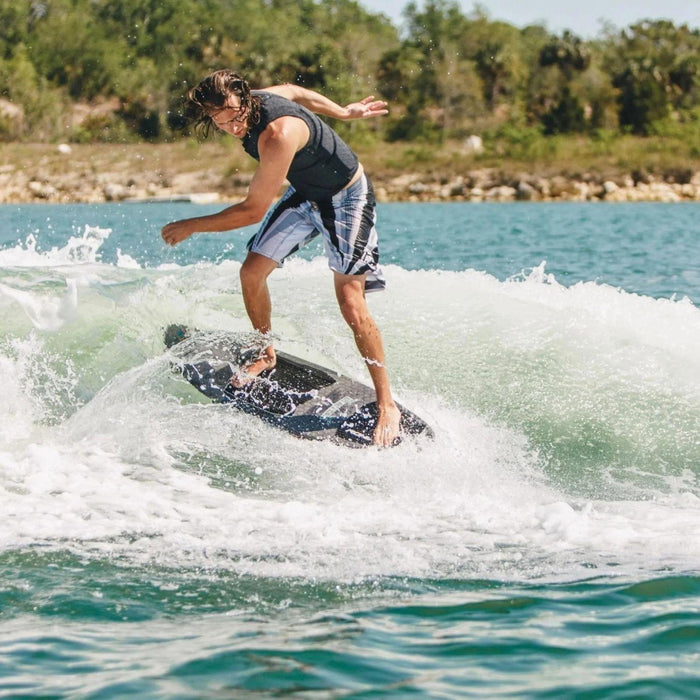 Pro rider Bryce Gardener performing a surface 360 on the 2026 Ronix M50, demonstrating its versatile twin-fin feel.