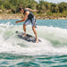 Pro rider Bryce Gardener performing a surface 360 on the 2026 Ronix M50, demonstrating its versatile twin-fin feel.