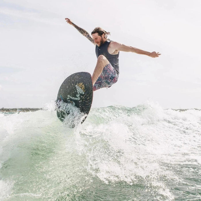 Pro rider Massi Piffaretti catching massive air on the 2026 Ronix M50 Dark Matter wakesurf board.