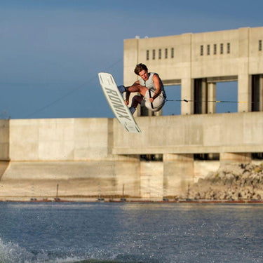 Tyler Higham executing a technical tweaked out grab on his responsive Ronix One Blackout wakeboard.