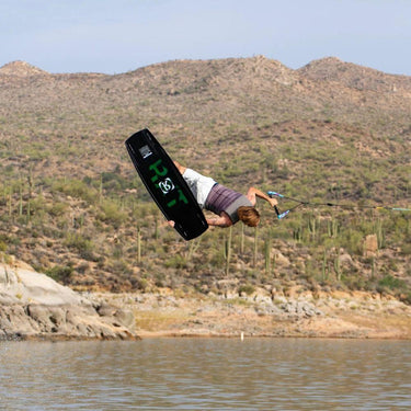 Pro rider Massi Piffaretti performing a huge tweaked-out invented grab on his new 2027 Ronix RXT pro model wakeboard