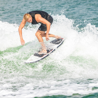 Pro rider Beaux Wildman throwing a heelside slide on the 2027 Ronix Sea Captain wakesurf board.
