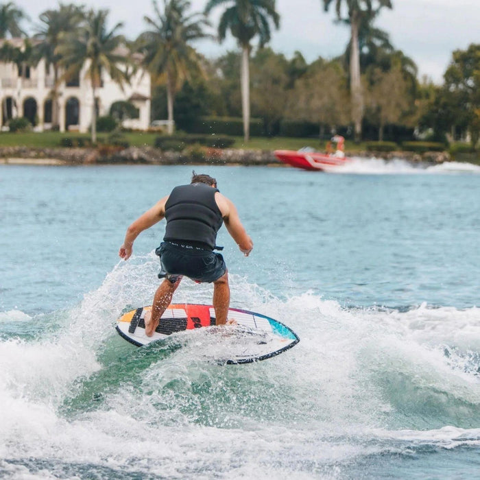 Rider cruising comfortably on the 2026 Ronix Standard Core Skimmer, showing its stable skim profile.