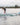Wakesurfer in motion doing a surface 360 on the 2026 Standard Core Skimmer. 