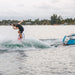 Wakesurfer in motion doing a surface 360 on the 2026 Standard Core Skimmer. 