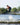Youth rider catching air and performing a tail grab wake-to-wake jump on the 2026 Ronix Vision.