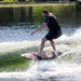 Large rider cruising effortlessly without a rope on the high-volume Ronix Wave King XL Skimmer.