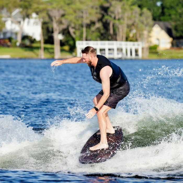 Rider demonstrating the loose skim feel of the Wave King XL by riding sideways on the wake.