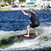 Rider celebrating in the sweet spot of the wake on the stable Ronix Wave King XL Skimmer.