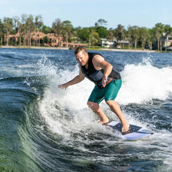 Rider executing a smooth bottom turn on the 2026 Ronix Wave King XL surfer behind a boat.