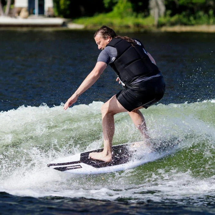 A bigger rider comfortably wakesurfing on the high-volume Ronix Wave King XL Flyweight board.