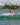 Woman rider learning to plane and ride straight behind the boat on the Ronix Krush asymmetrical wakeboard.