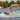 Woman wakesurfer executing a deep carve at the top of the wake on the Women's Sea Captain Tuff Tech.
