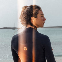 Load image into Gallery viewer, 2024 Manera Women&#39;s Seafarer Bikisuit 2.0 Wetsuit - Wakesports Unlimited | Action Shot
